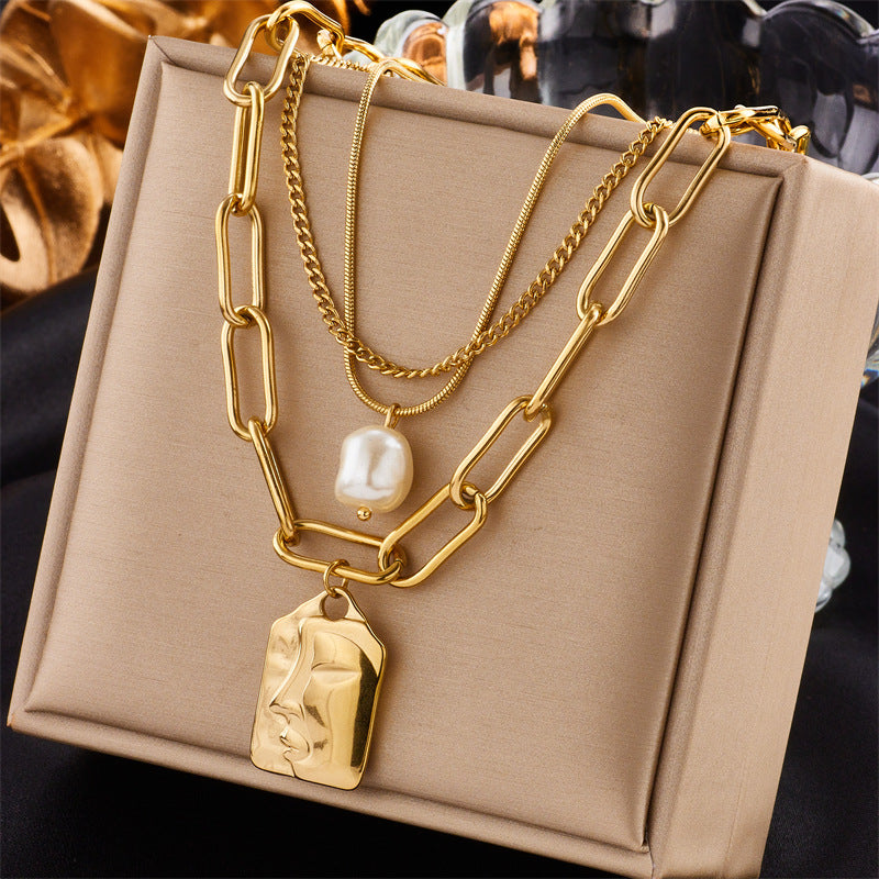 Gold layered necklace set on model