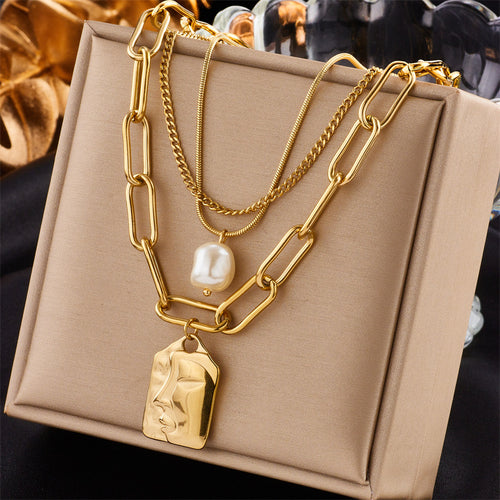 Gold layered necklace set on model