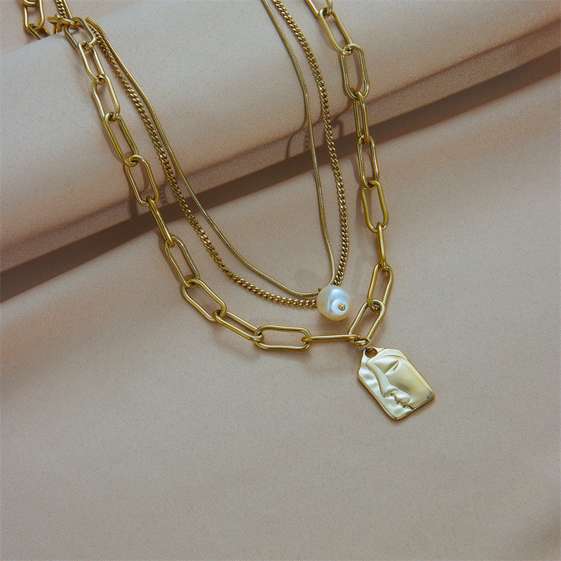 Layered gold chains detail