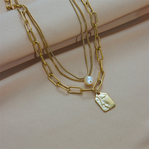 Layered gold chains detail