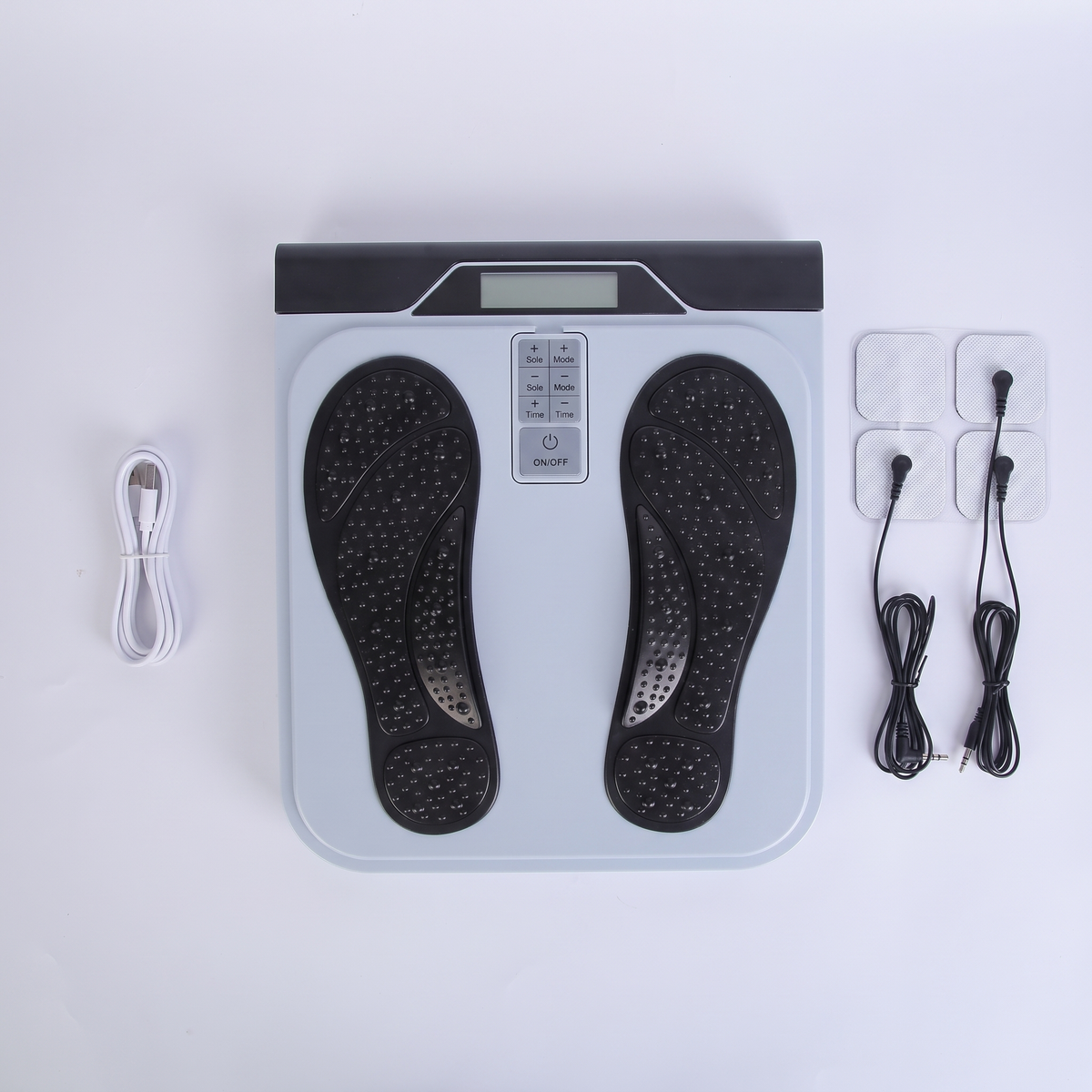 What's in the box — CircuFlow pad, USB charging cable, TENS electrode pads